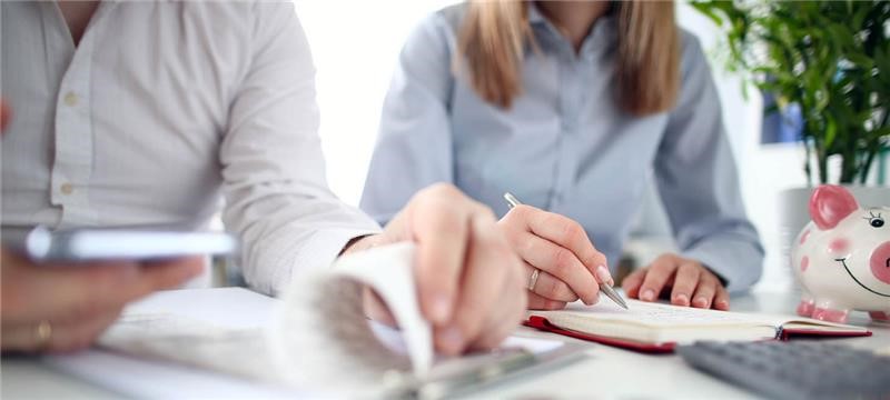 person writing checklist